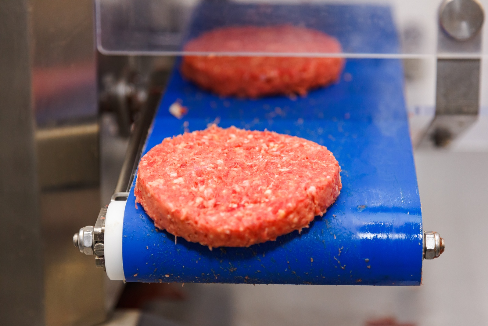 bigstock-Hamburger-Meat-On-Conveyor-Bel-172177406