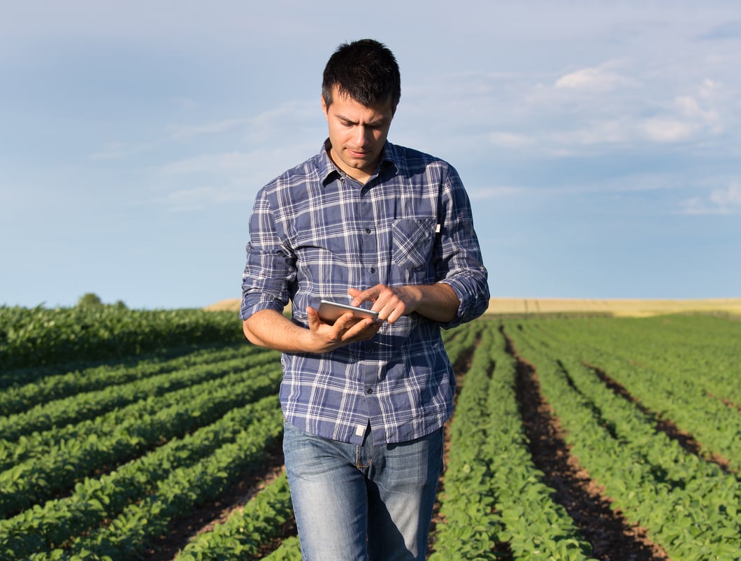 bigstock-Farmer-With-Tablet-In-Soybean--194978200